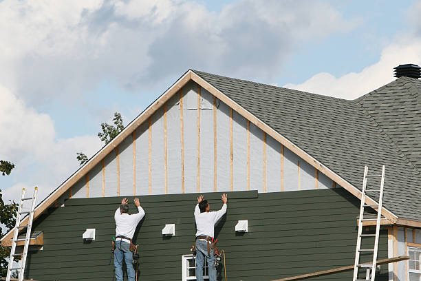 Professional Storm Damage Siding Repair technician working in Fort Washington, PA